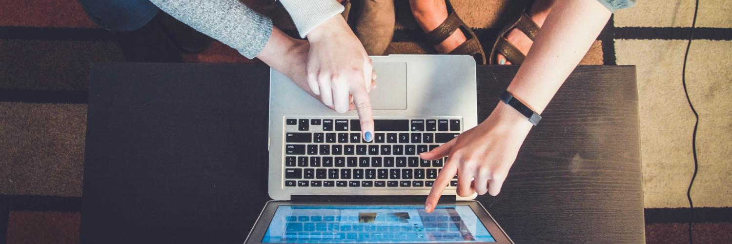 Women touching laptop