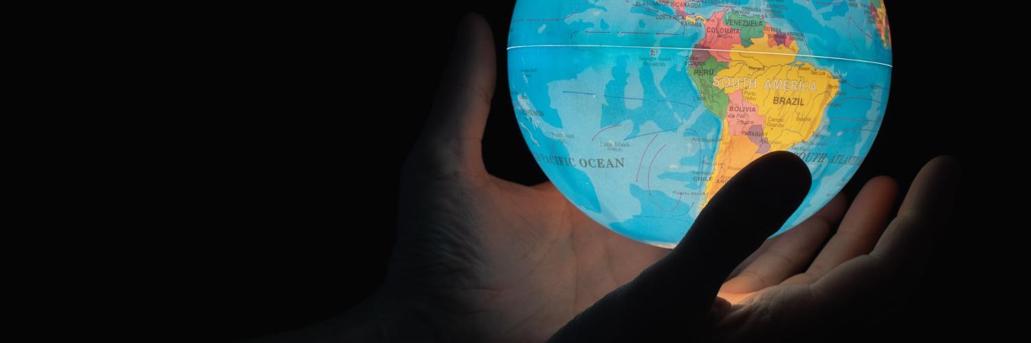 world in hand in the dark